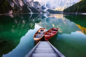 elmoutahida united puzzles- two wooden boats docked on a lake